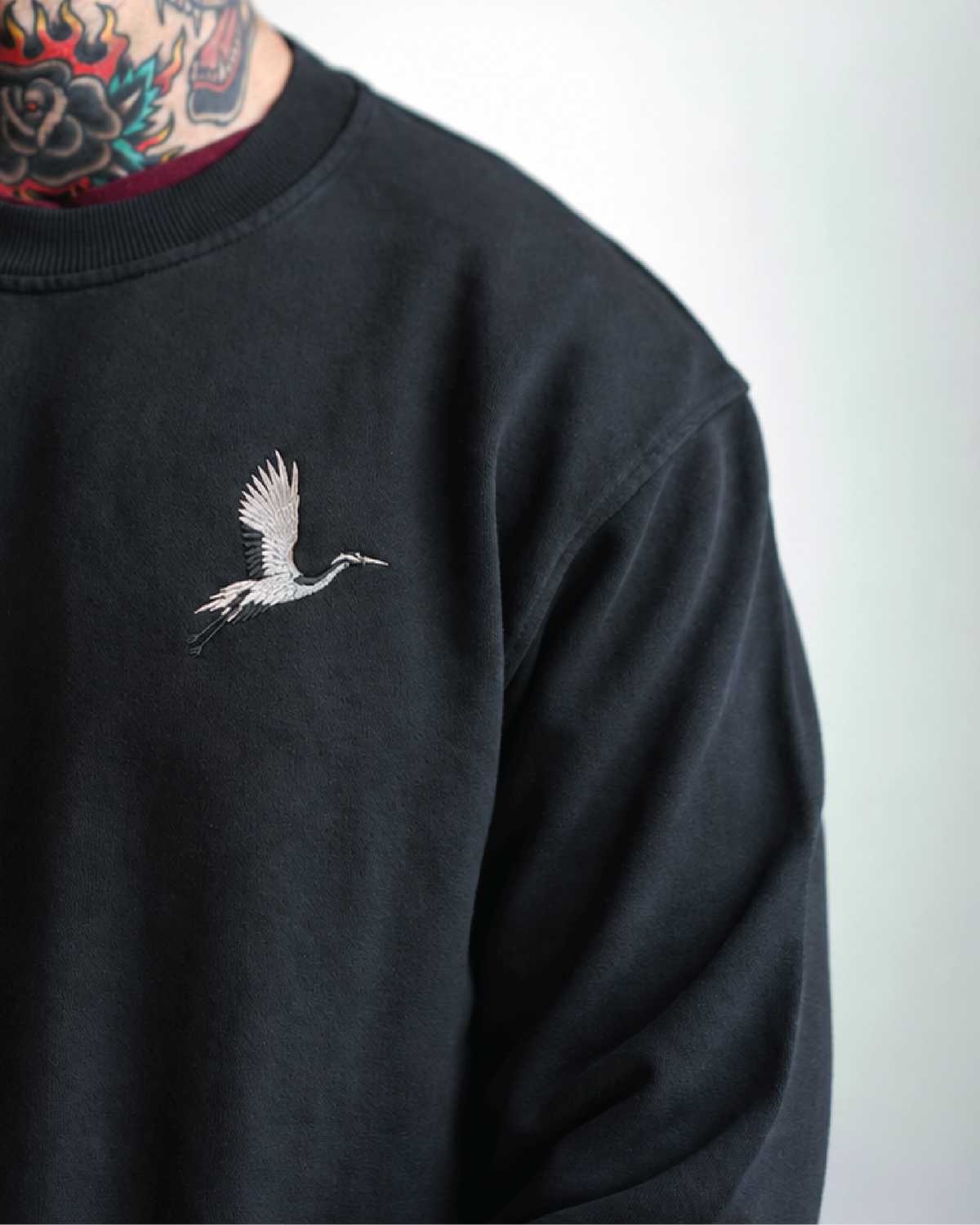 Origami Echo Crewneck in Black, crane embroidery and collar detail