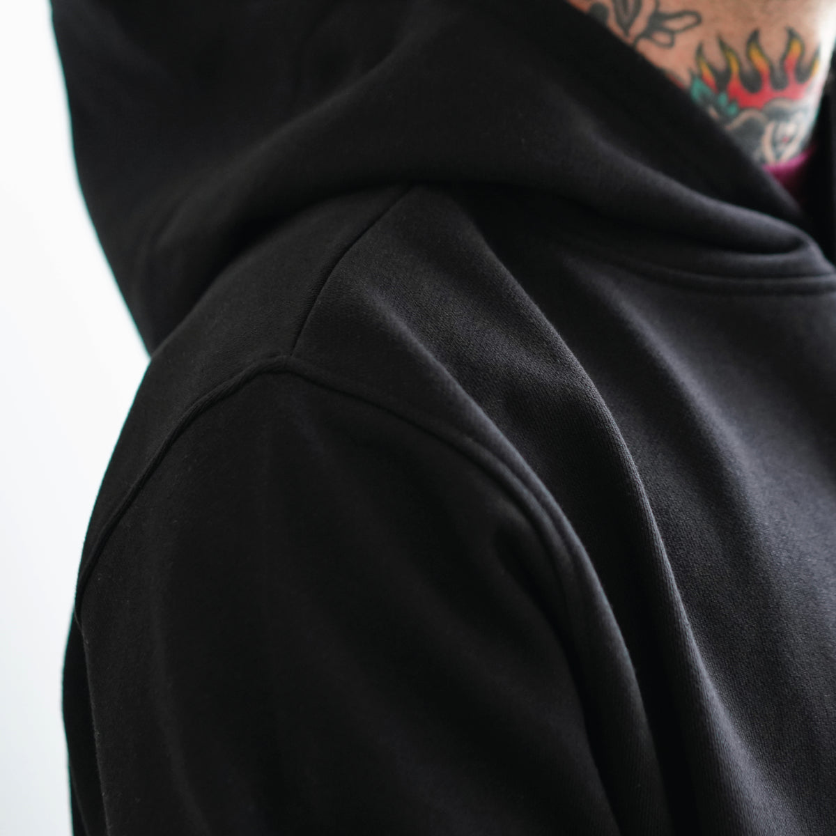 Black hoodie, side view with the hood up
