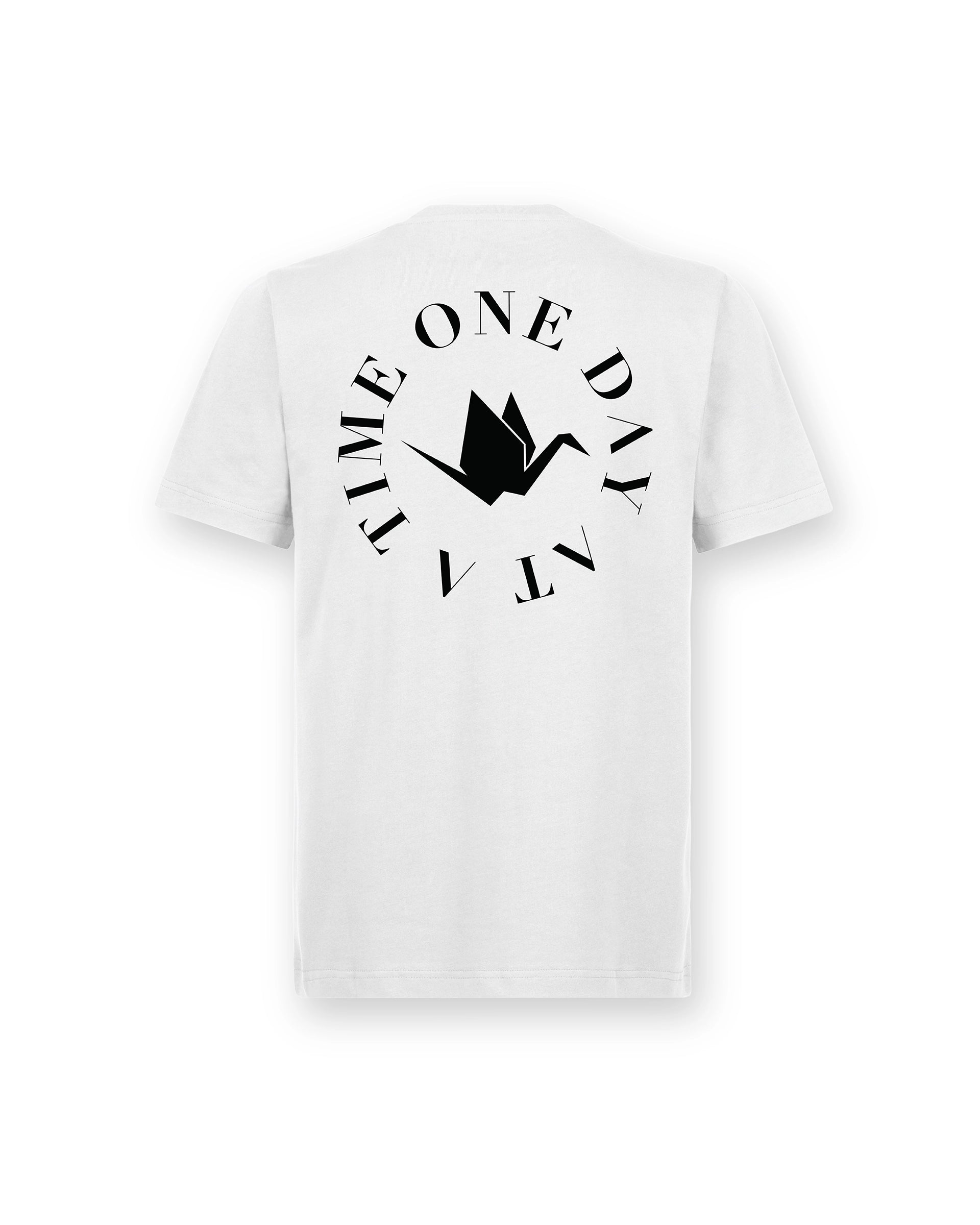 Back of Circle of Resilience Tee in Arctic White featuring a black crane emblem encircled by the phrase ‘One Day At A Time.’