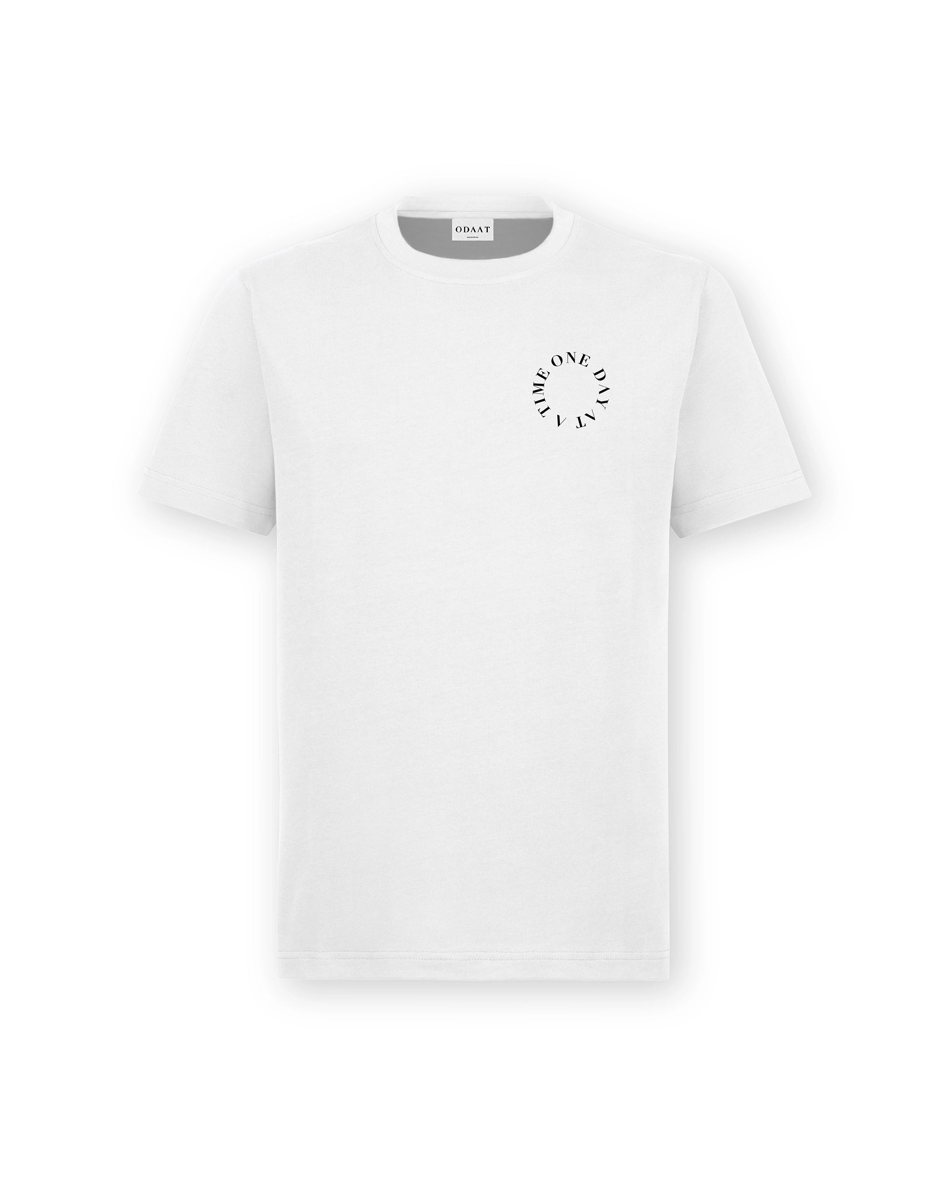Front of Circle of Resilience Tee in Arctic White with a high-contrast black circle design on the left chest, spelling ‘One Day At A Time.’
