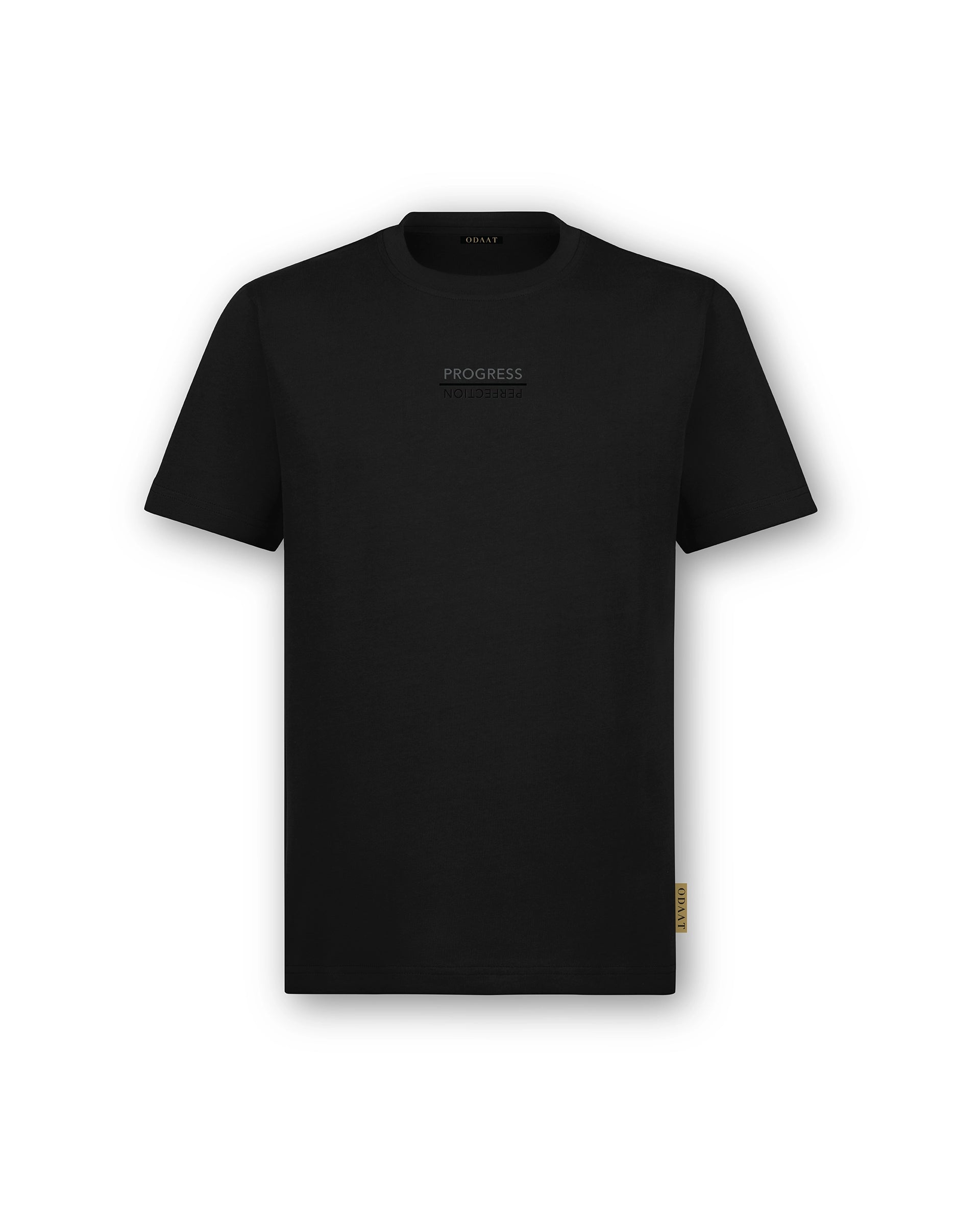 Front of Progress Over Perfection Tee featuring a centered raised print graphic that reads ‘Progress Over Perfection.’ Minimal design with a textured, tactile feel.