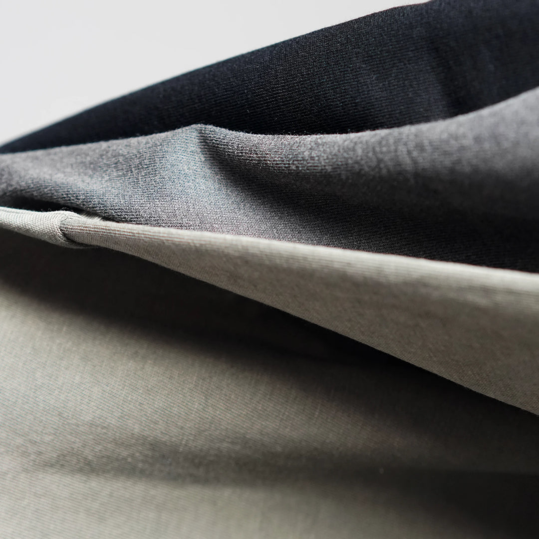 Garment-washed organic cotton jersey of the Midweight Tee in Black, Washed Black and Olive