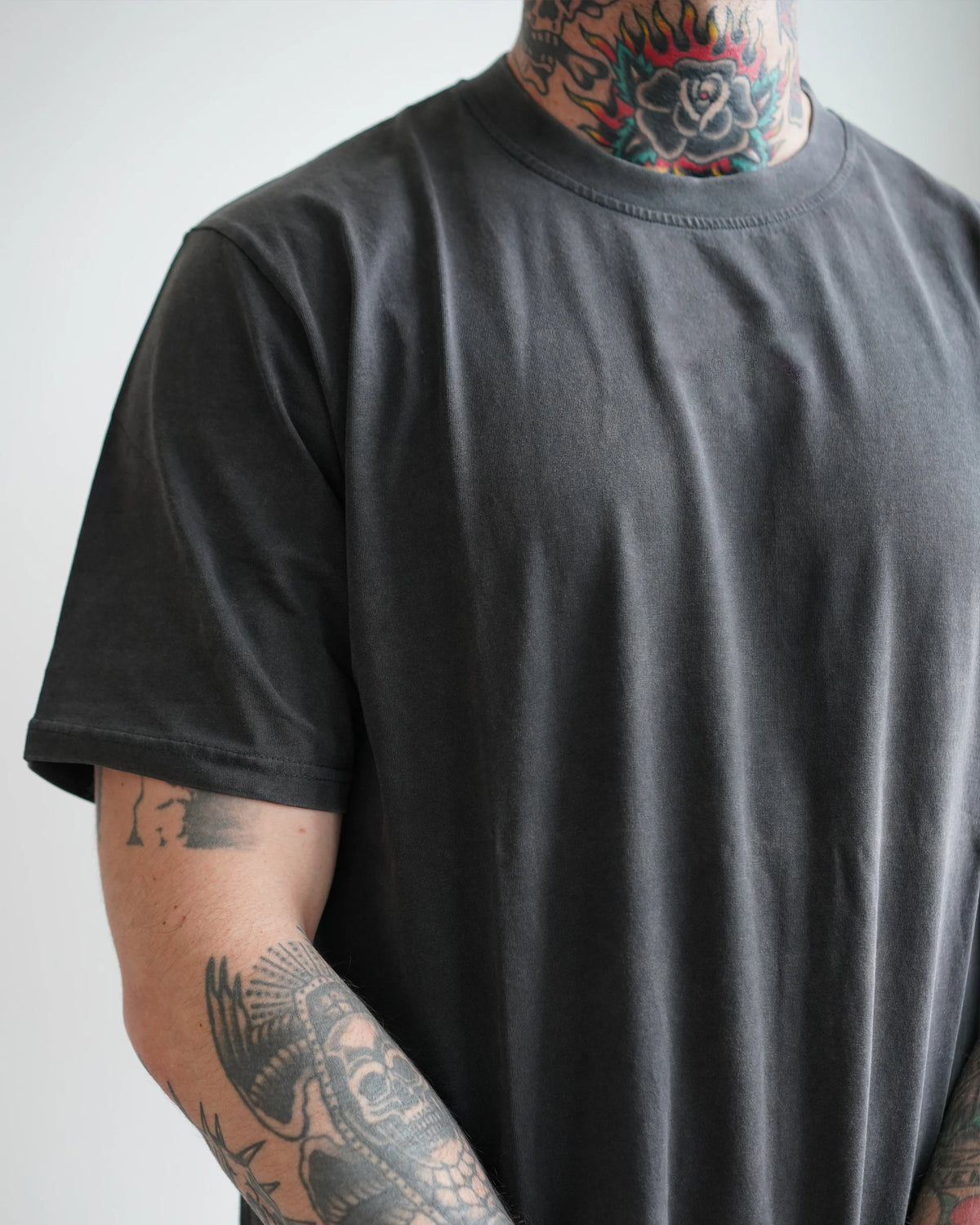 Midweight Tee in Washed Black, front view, regular fit through the chest and shoulder
