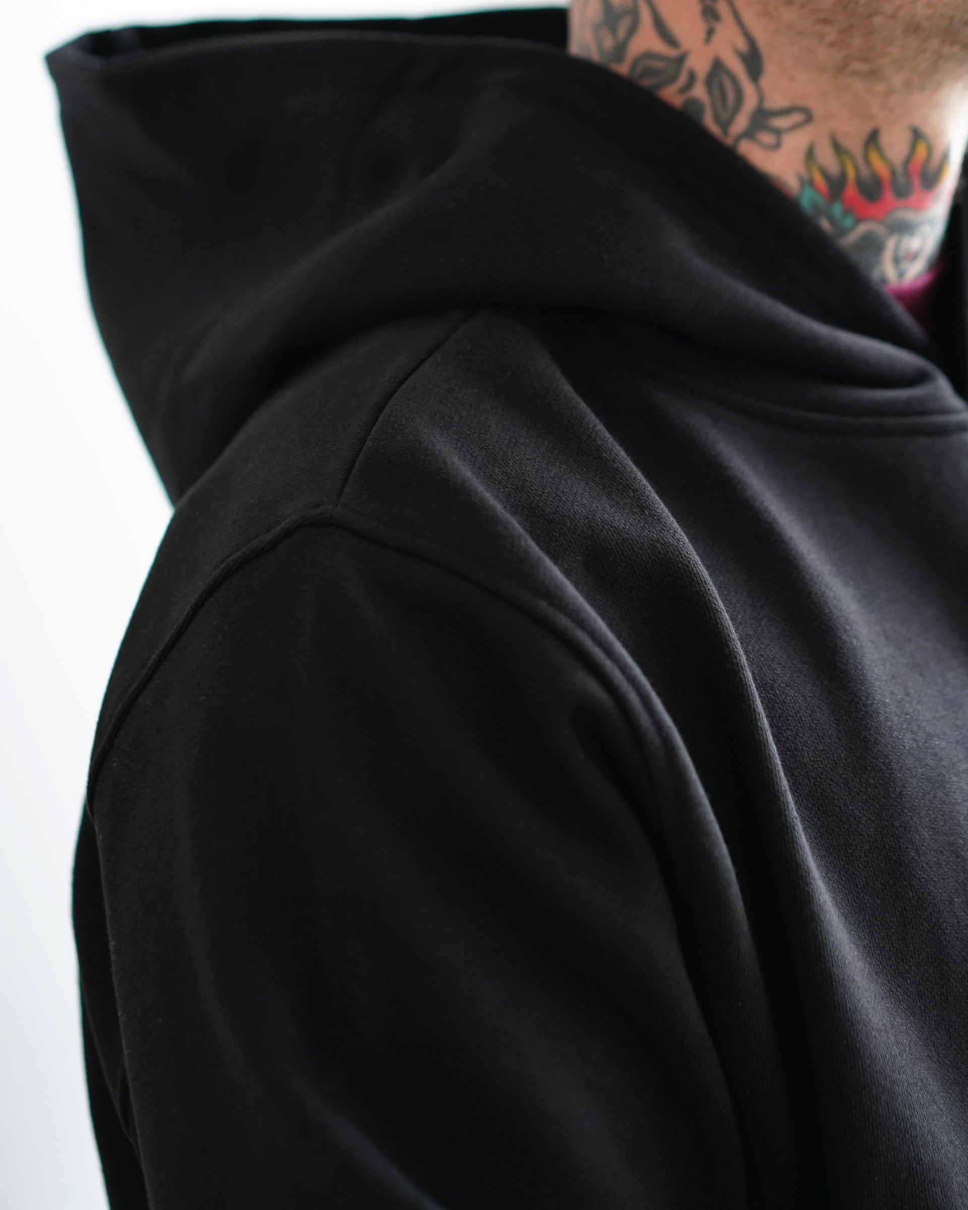 Black hoodie, side view with the hood up
