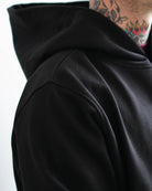 Black hoodie, side view with the hood up