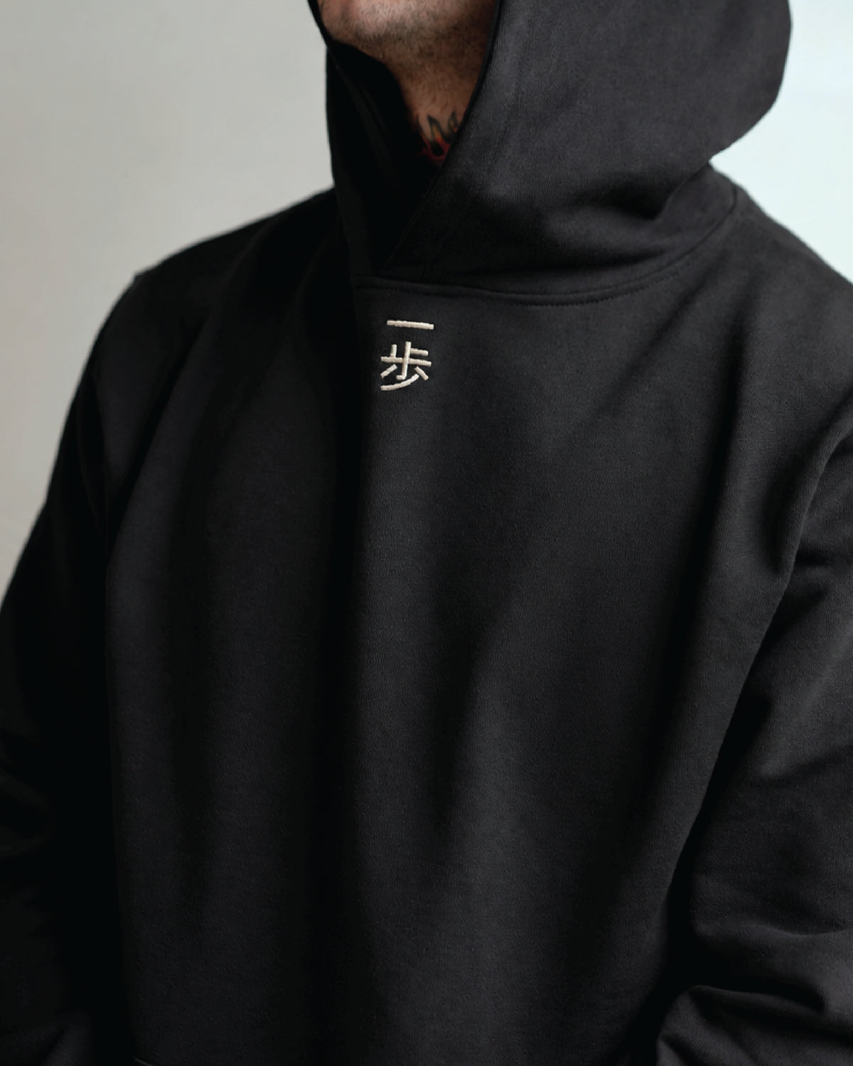 KyoPace Hoodie in Black, One Step embroidery below the neckline