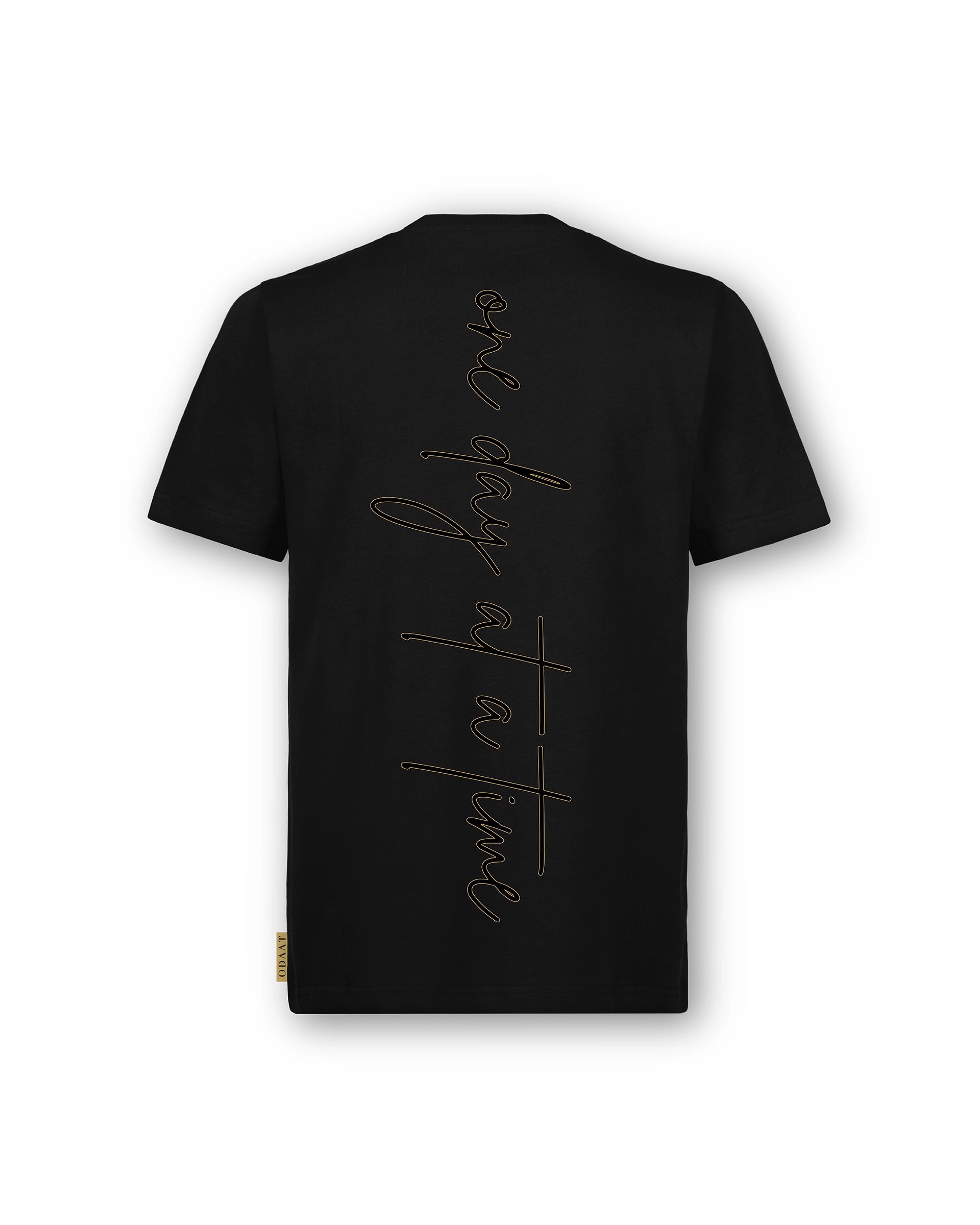 Back of Script Tee featuring ‘One Day At A Time’ printed in gold ochre across the spine of the back. Minimalist design on premium organic cotton.