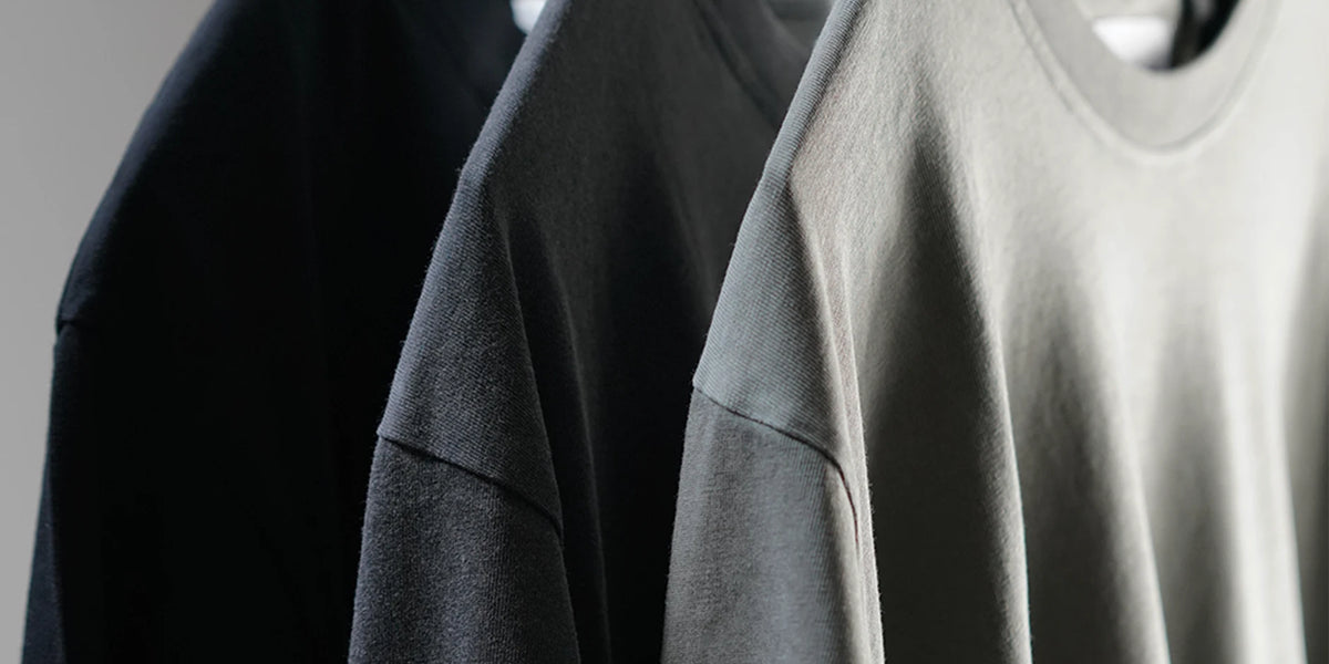 Midweight Tee in Black, Washed Black and Olive on hangers