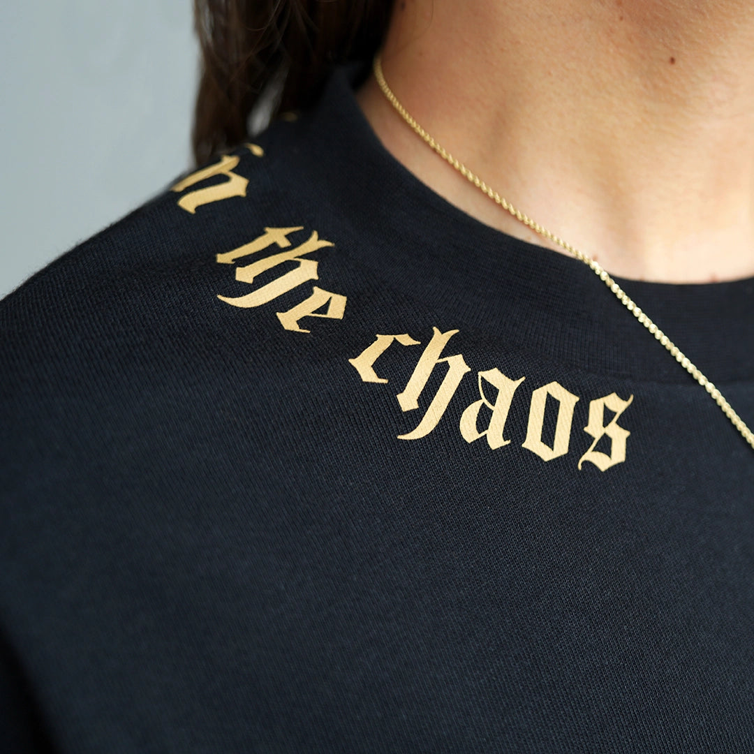 Calm in the Chaos boxy crop tee back collar graphic