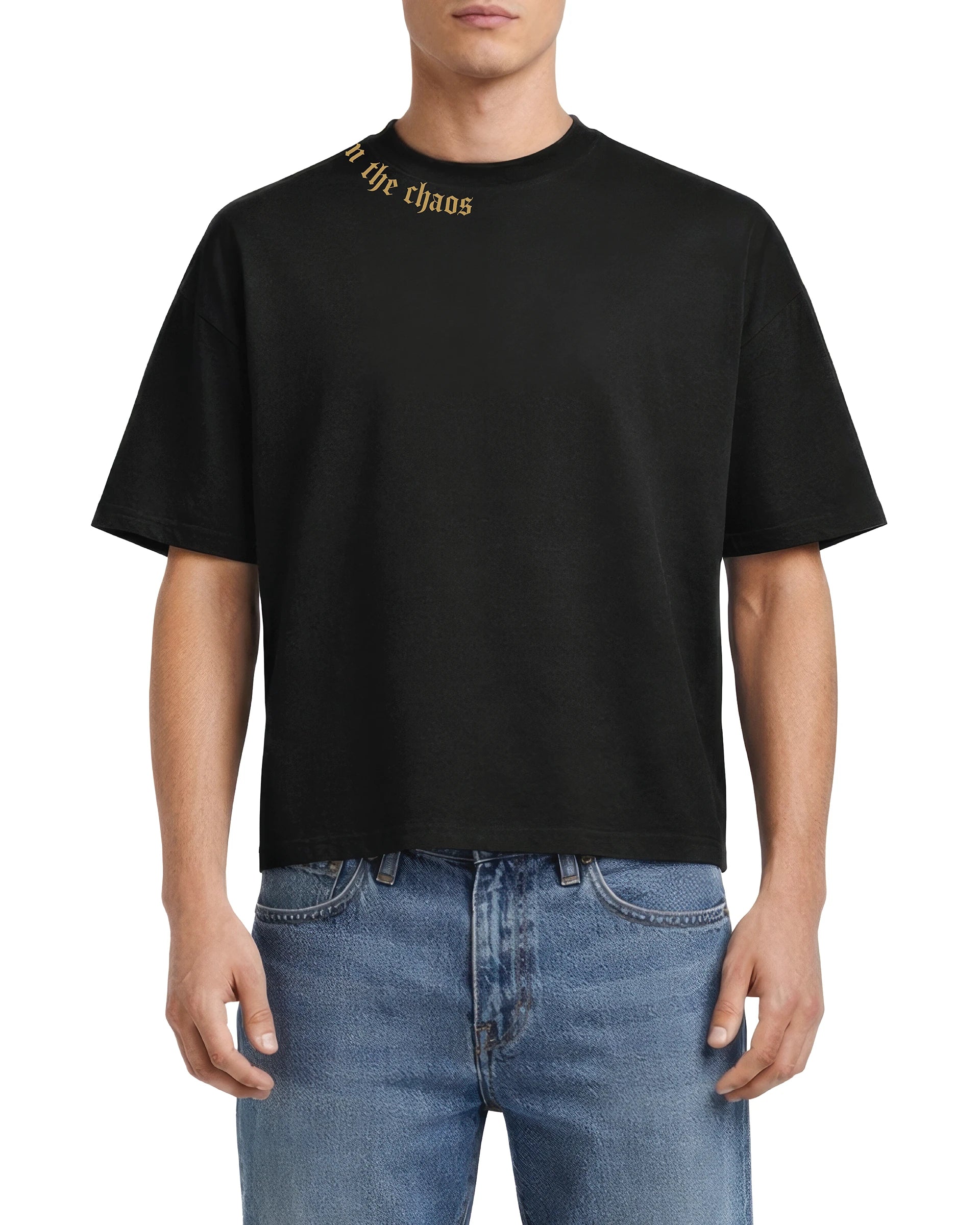 Calm in the Chaos boxy cropped tee in black, worn with blue jeans